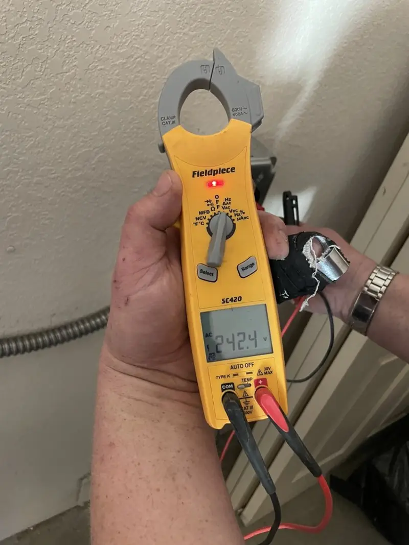 Voltage testing with clamp meter during Aluminum Wiring Replacement in Salem Lakes